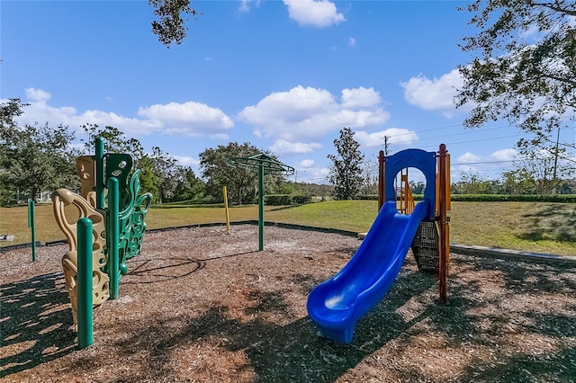 view of play area featuring a lawn