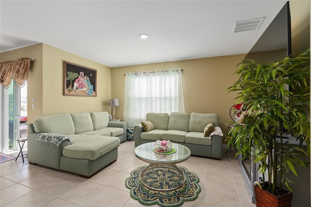 living room with light tile patterned floors