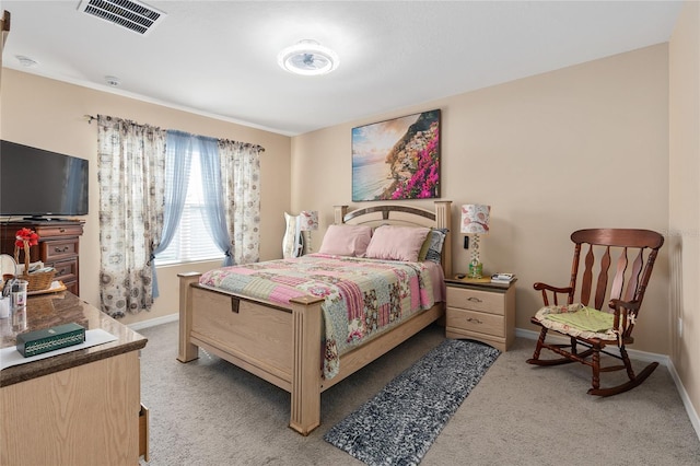 bedroom featuring light carpet