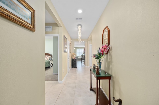 corridor featuring light tile patterned floors