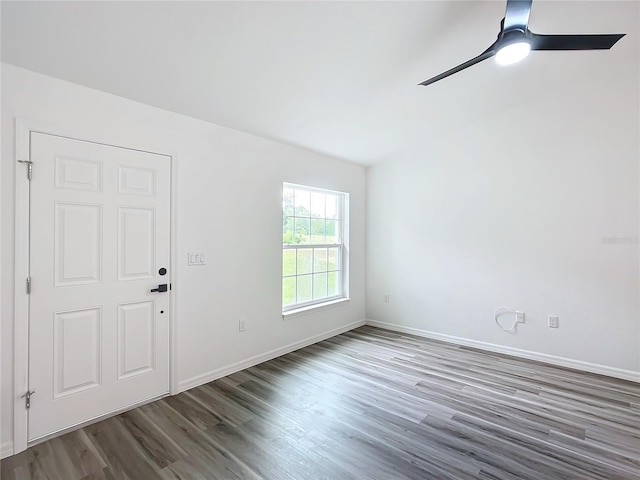 unfurnished room featuring dark hardwood / wood-style flooring and ceiling fan