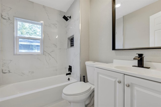 full bathroom with vanity, toilet, and tiled shower / bath