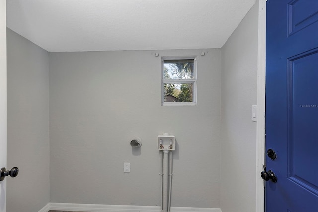 laundry area featuring a textured ceiling