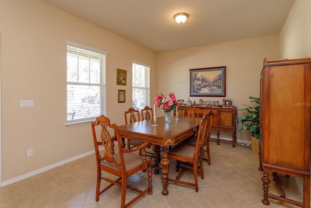 dining space featuring light tile patterned floors