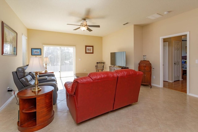 living room featuring ceiling fan and light tile patterned floors