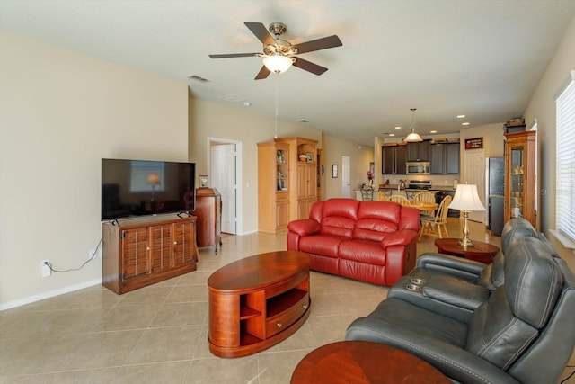 living room featuring ceiling fan and light tile patterned floors