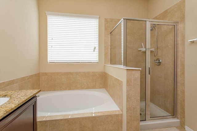 bathroom with plus walk in shower and vanity