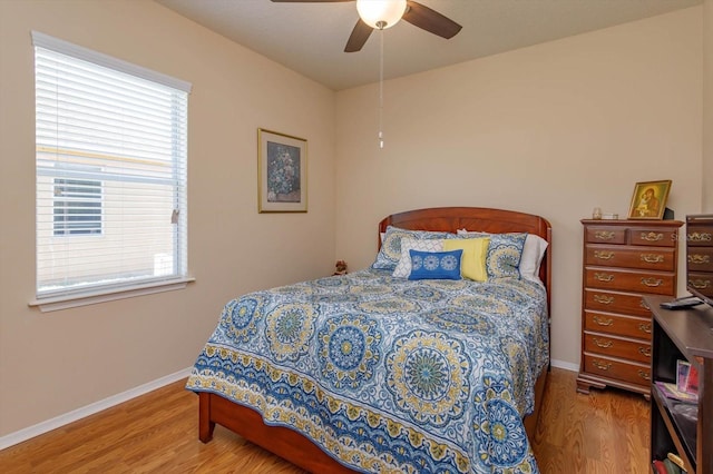 bedroom featuring ceiling fan and hardwood / wood-style floors