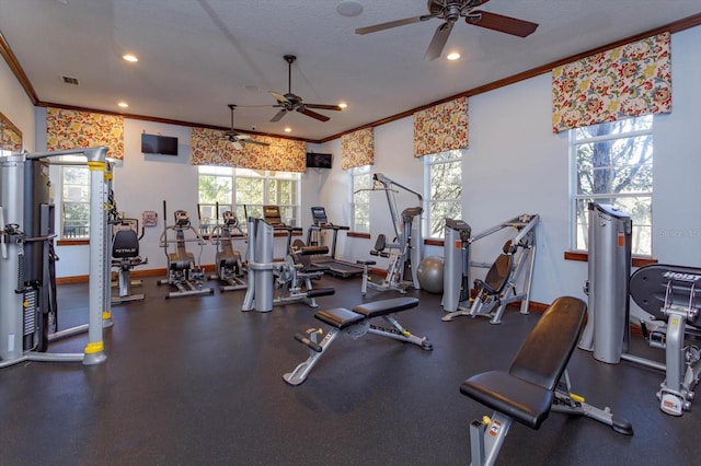 exercise room with a textured ceiling, ceiling fan, and crown molding