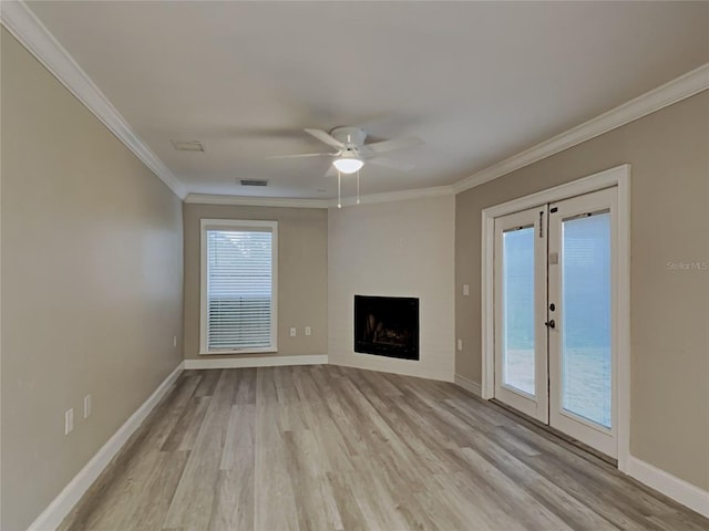 unfurnished living room with ceiling fan, french doors, crown molding, and light hardwood / wood-style flooring