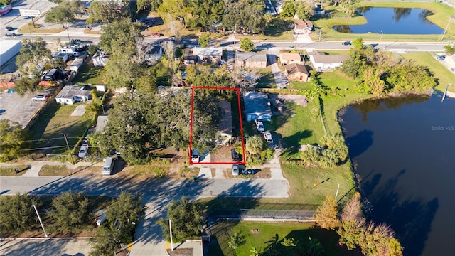 birds eye view of property featuring a residential view and a water view