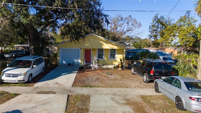 view of front of property featuring driveway and stucco siding