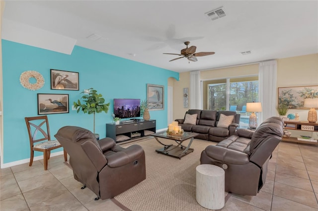 tiled living room featuring ceiling fan