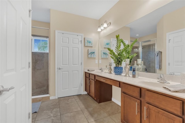 bathroom with tile patterned flooring, vanity, and a shower with shower door