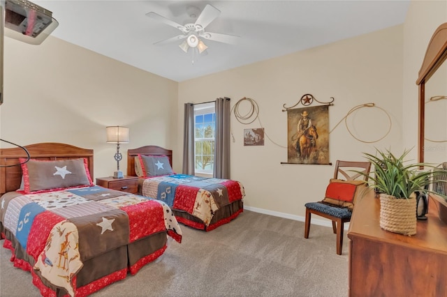 bedroom featuring light colored carpet and ceiling fan