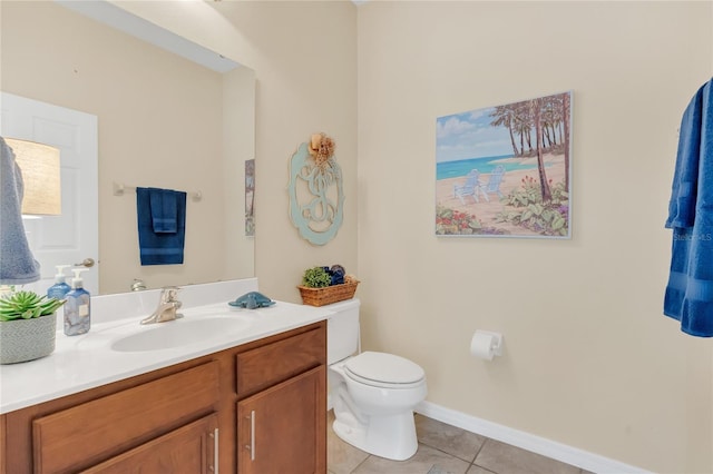 bathroom featuring vanity, tile patterned floors, and toilet