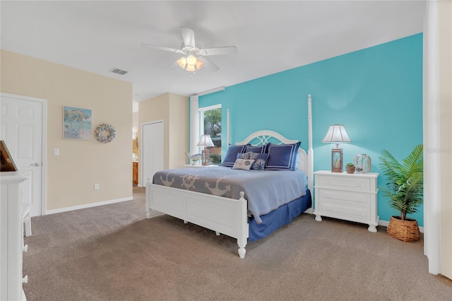 carpeted bedroom featuring connected bathroom and ceiling fan