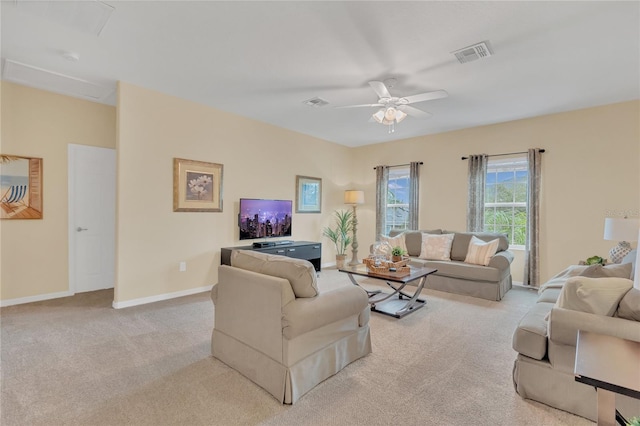 living room featuring light carpet and ceiling fan