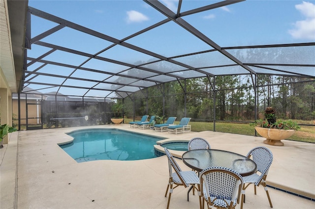 view of pool with a patio, a lanai, and an in ground hot tub