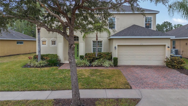 view of front of house featuring a garage and a front yard