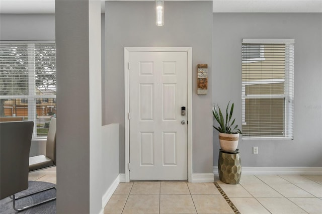 foyer featuring light tile patterned floors