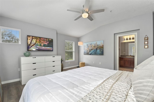 bedroom featuring vaulted ceiling, ceiling fan, sink, wood-type flooring, and connected bathroom