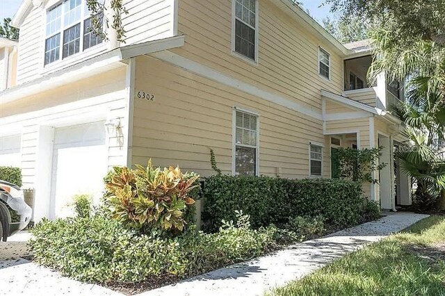 view of property exterior featuring a garage