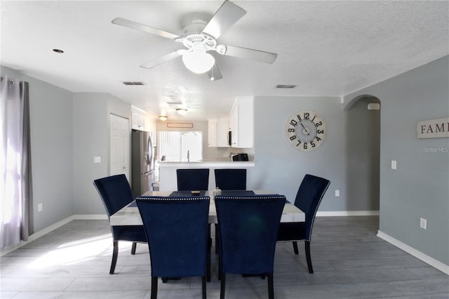 dining room featuring ceiling fan