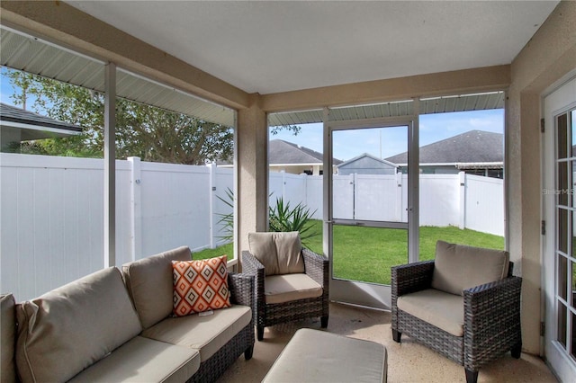 sunroom / solarium featuring a healthy amount of sunlight