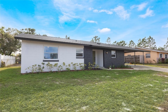 single story home featuring a front yard and a carport