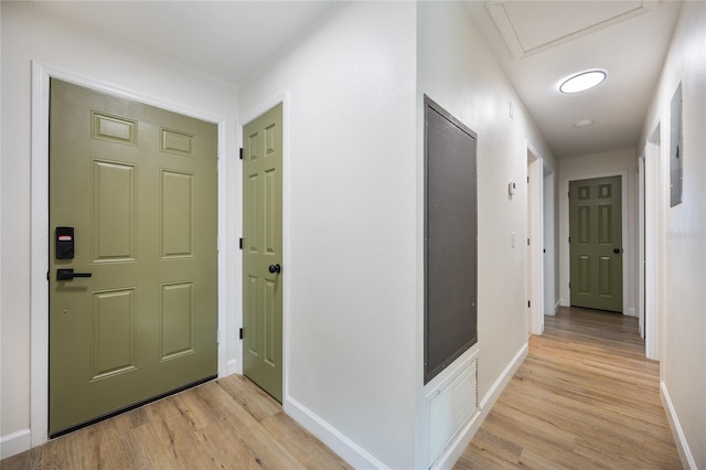 hallway with light hardwood / wood-style flooring