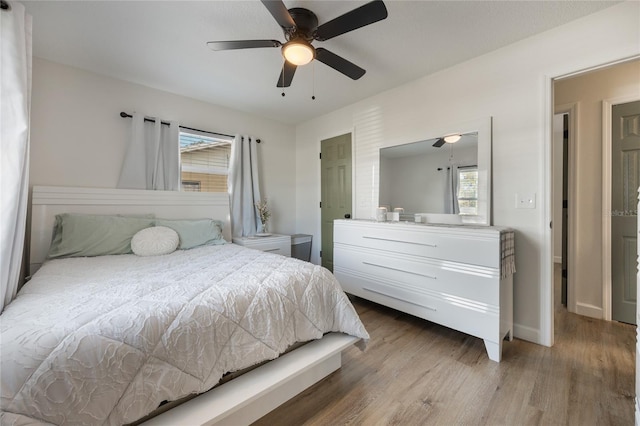 bedroom featuring ceiling fan and wood-type flooring