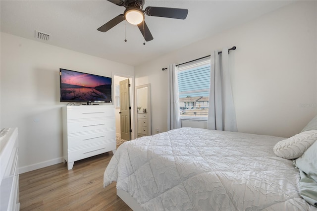 bedroom with hardwood / wood-style flooring and ceiling fan