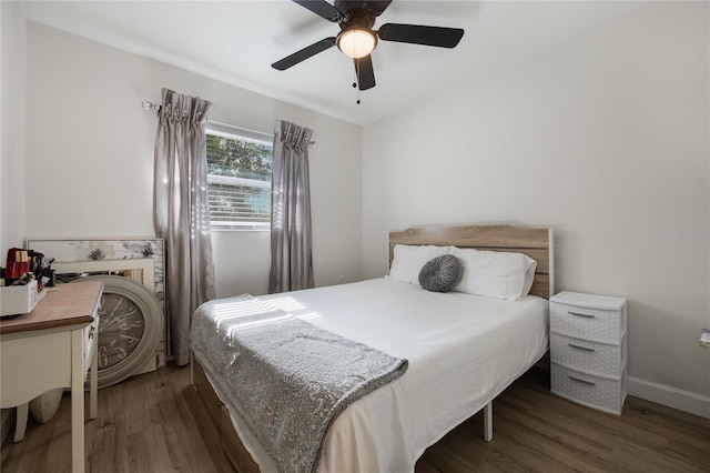 bedroom featuring ceiling fan and dark wood-type flooring