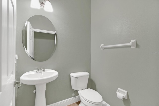 bathroom featuring sink and toilet