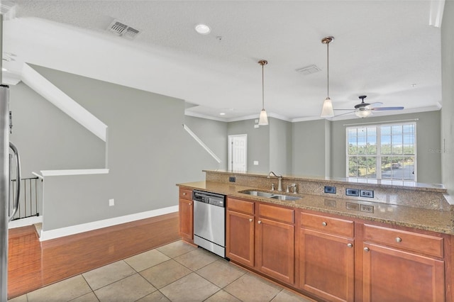 kitchen with ceiling fan, dishwasher, sink, pendant lighting, and light tile patterned flooring