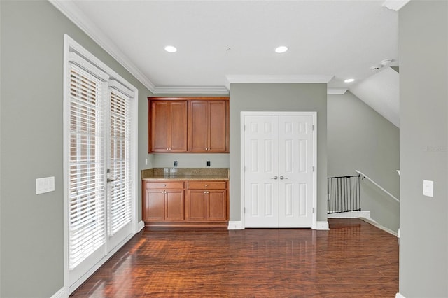 kitchen with crown molding and dark wood-type flooring