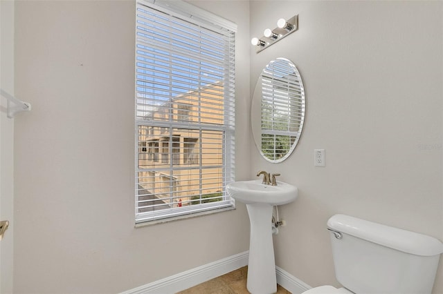 bathroom with tile patterned floors and toilet