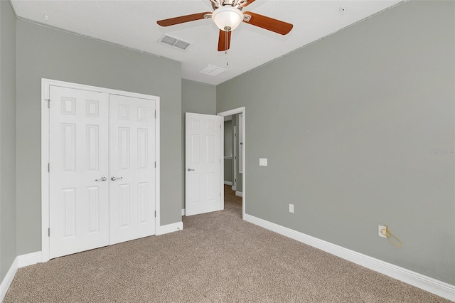 unfurnished bedroom featuring carpet flooring, a closet, and ceiling fan