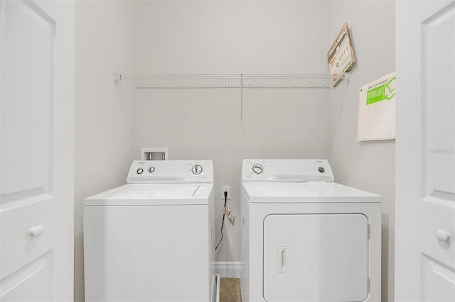 washroom with washer and clothes dryer