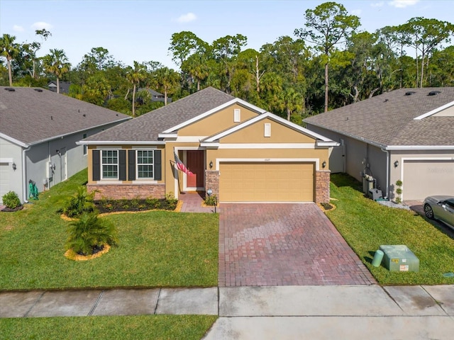 single story home with a garage and a front lawn