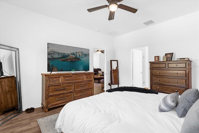 bedroom with wood-type flooring and ceiling fan