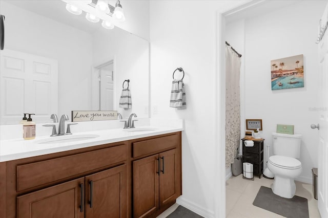 bathroom featuring tile patterned floors, a shower with curtain, vanity, and toilet