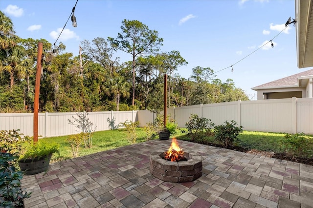 view of patio / terrace with an outdoor fire pit