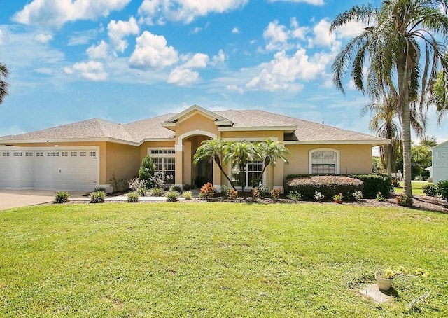 single story home with a front yard and a garage