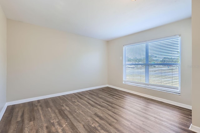 empty room featuring dark wood-type flooring