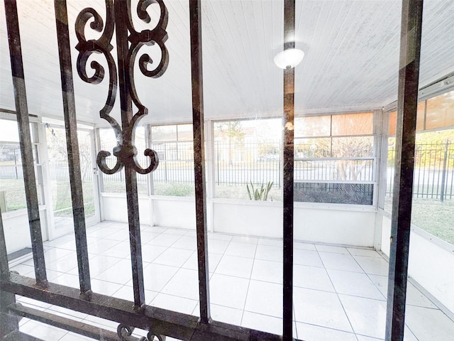 unfurnished sunroom featuring wooden ceiling