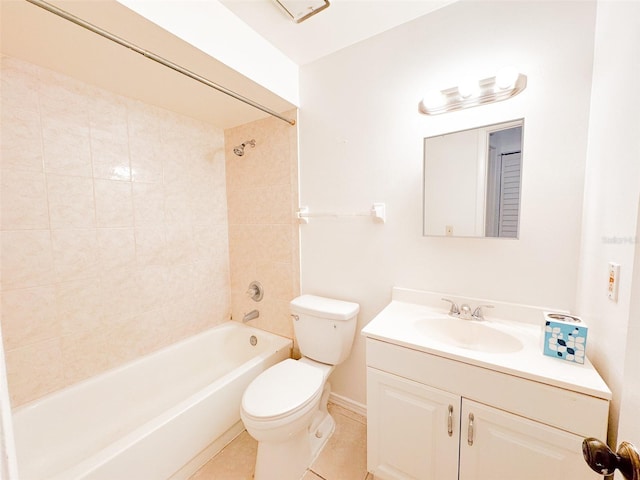 full bathroom with tile patterned flooring, vanity, tiled shower / bath combo, and toilet