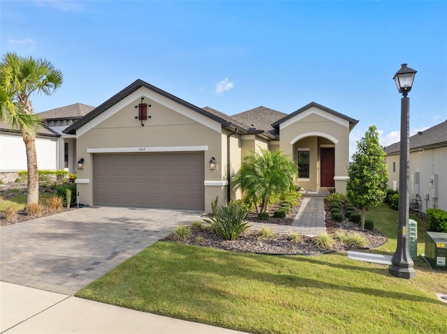 view of front of home featuring a front yard and a garage