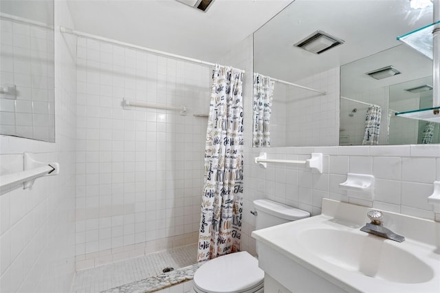 bathroom featuring decorative backsplash, a shower with curtain, vanity, tile walls, and toilet